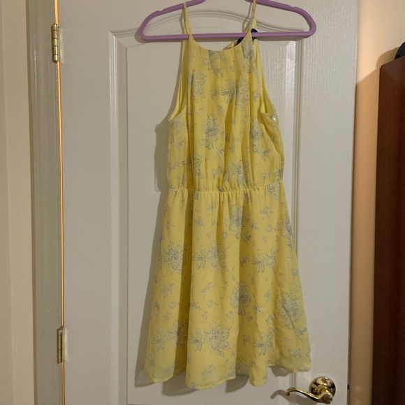 Francesca's Collections Dresses & Skirts - New with tags. Medium yellow dress with flower white and blue from Francescas